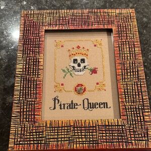 Framed Pirate Queen Cross-Stitch Art in Gold and Red Frame